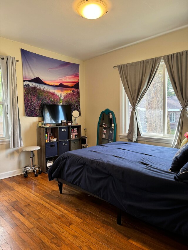 bedroom with hardwood / wood-style floors