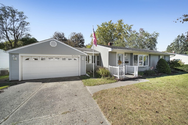 ranch-style house featuring a garage and a front lawn