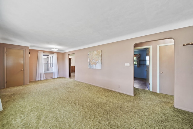 spare room with carpet floors