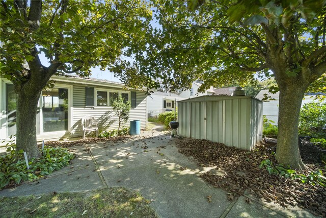 view of side of property with a patio area