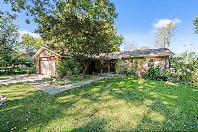 view of front of property with a front lawn and a garage