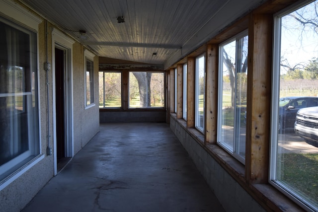 sunroom featuring lofted ceiling