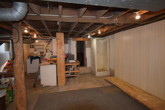 basement featuring washer and clothes dryer