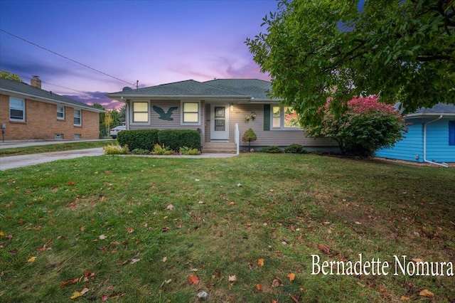 view of front of house with a lawn