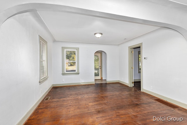 spare room featuring dark hardwood / wood-style floors