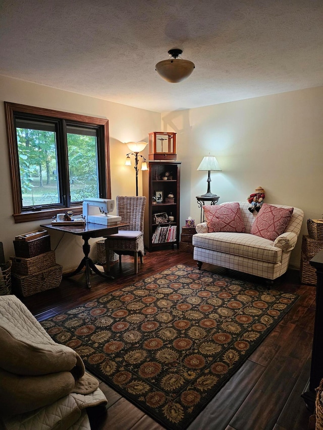 interior space featuring hardwood / wood-style flooring and a textured ceiling