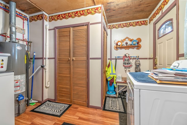 washroom featuring gas water heater, washer / dryer, wooden ceiling, and light hardwood / wood-style floors