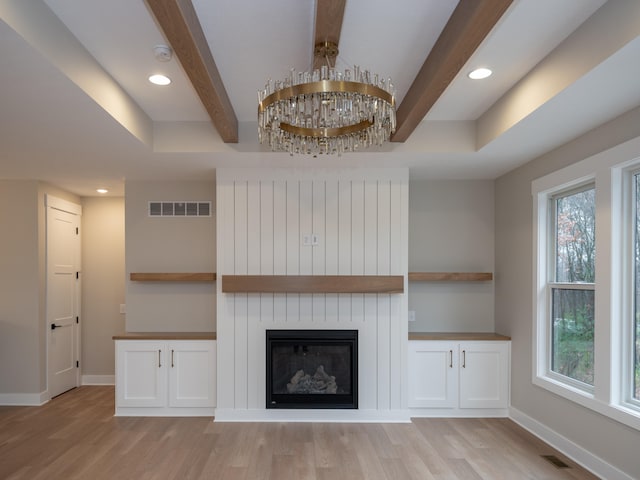 unfurnished living room with light hardwood / wood-style flooring and a wealth of natural light