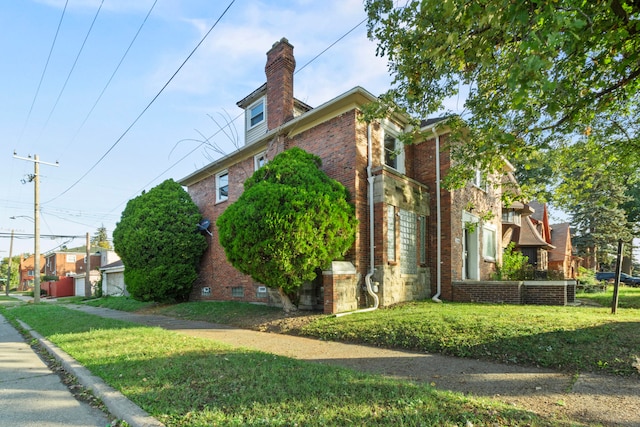 view of home's exterior with a yard