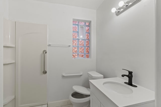 bathroom with tile patterned floors, vanity, and toilet