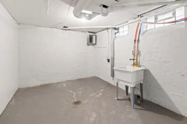 basement featuring a textured ceiling