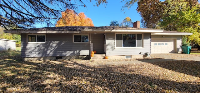 ranch-style home featuring a garage