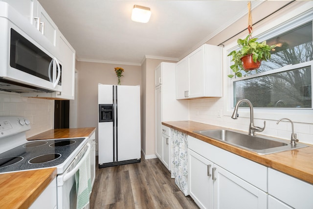 kitchen featuring backsplash, white cabinetry, sink, and white appliances