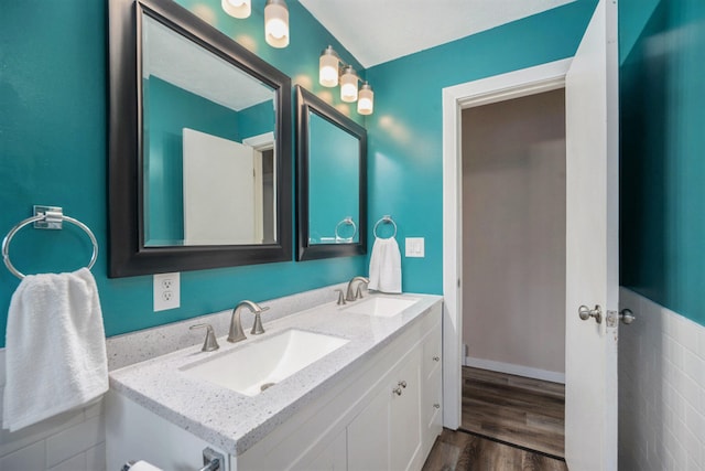 bathroom with wood-type flooring and vanity