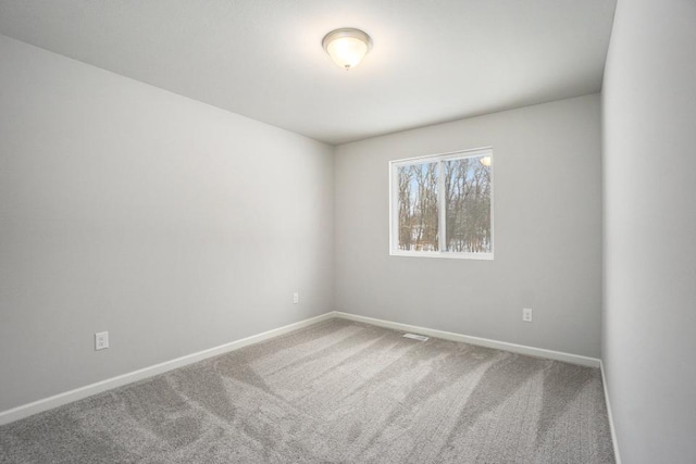 unfurnished room with carpet floors