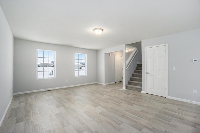 unfurnished room featuring light wood-type flooring