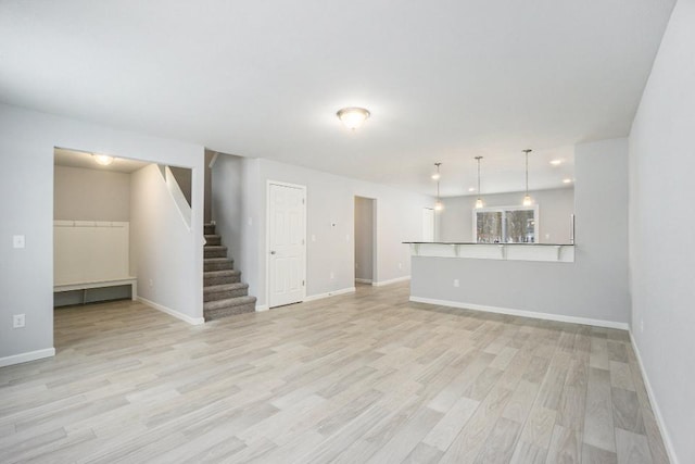 unfurnished living room with light wood-type flooring