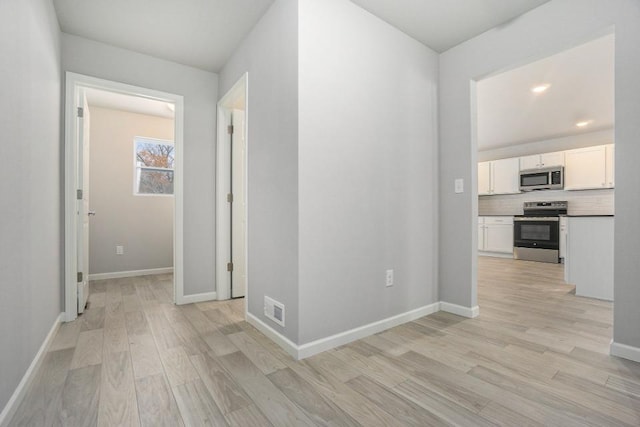 hall featuring light hardwood / wood-style floors