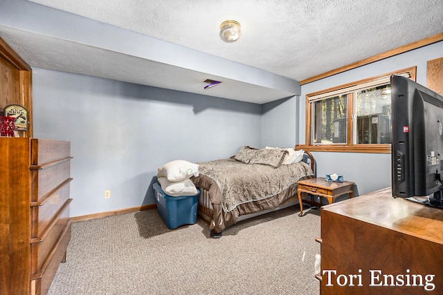 carpeted bedroom with a textured ceiling