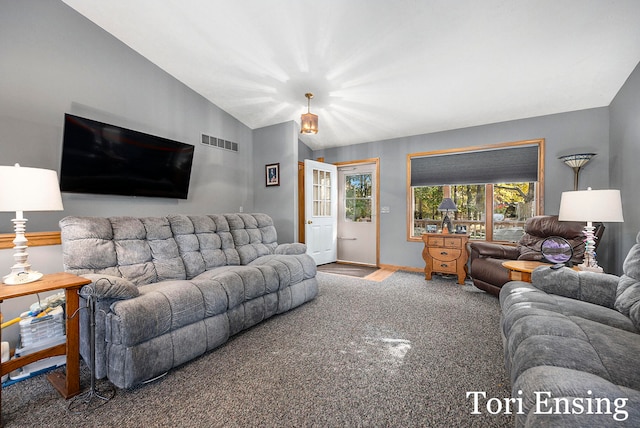 living room with lofted ceiling and carpet flooring