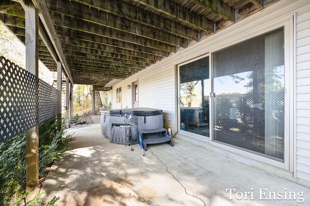 view of patio featuring a hot tub