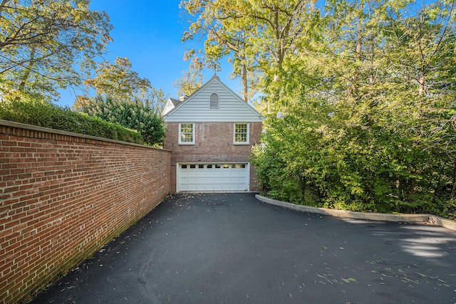 view of side of property with a garage