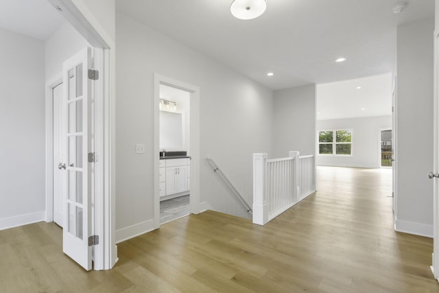 corridor featuring light wood-type flooring