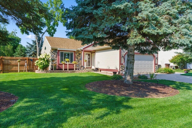 single story home with a front yard and a garage