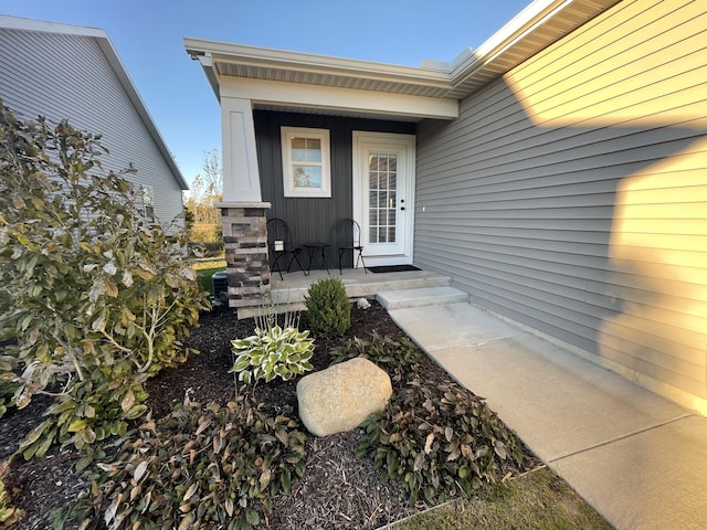 doorway to property featuring covered porch