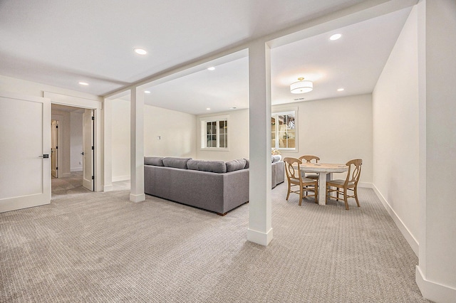 living area with recessed lighting, carpet floors, and baseboards