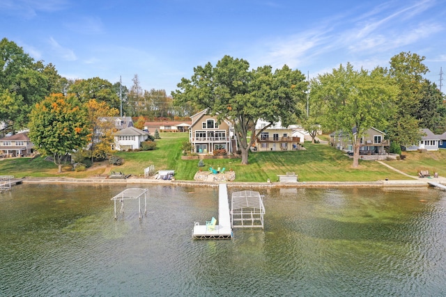 exterior space featuring a yard, a water view, and a residential view