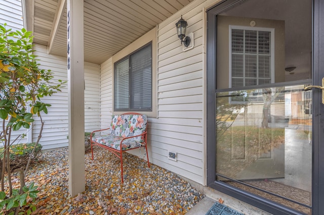 view of exterior entry featuring a porch