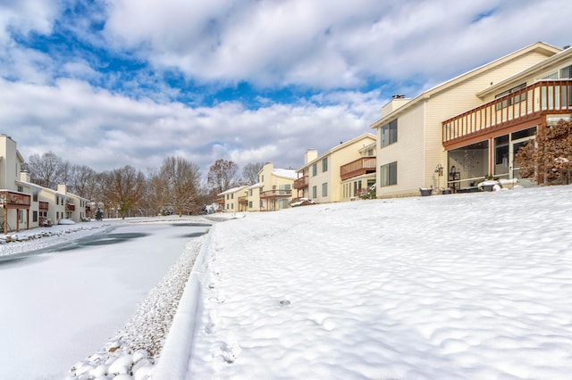 view of yard layered in snow