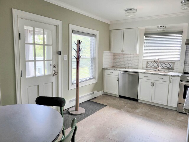 kitchen featuring white cabinets, ornamental molding, sink, stainless steel appliances, and decorative backsplash