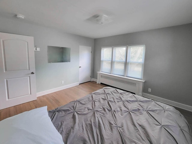 bedroom with light wood-type flooring