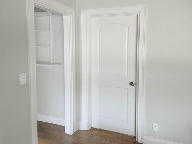 hallway featuring dark hardwood / wood-style floors