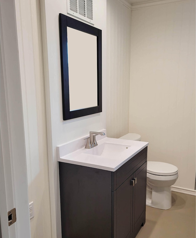 bathroom featuring vanity and toilet