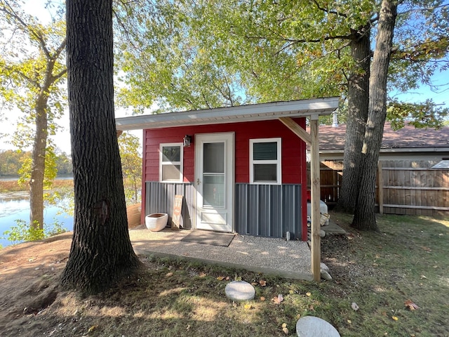 view of outbuilding featuring a water view