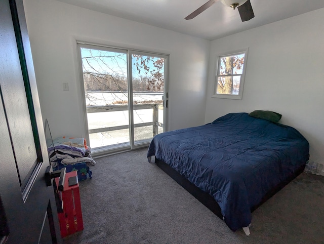 bedroom featuring ceiling fan and carpet