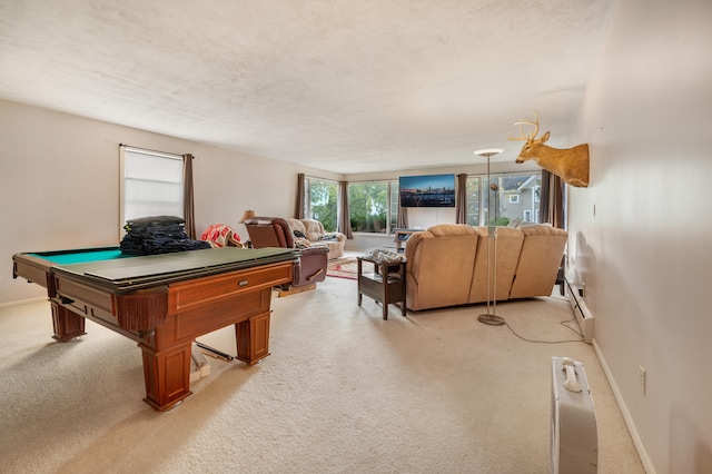 playroom featuring pool table, a textured ceiling, and light carpet