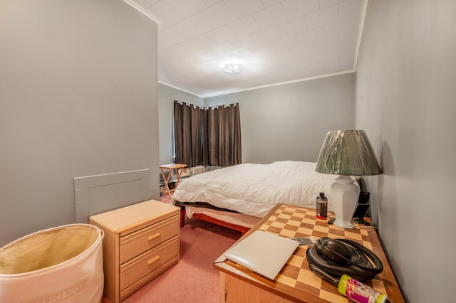 carpeted bedroom featuring crown molding