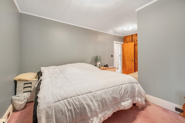 carpeted bedroom with crown molding