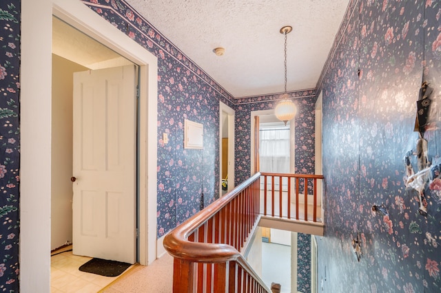 corridor with a textured ceiling