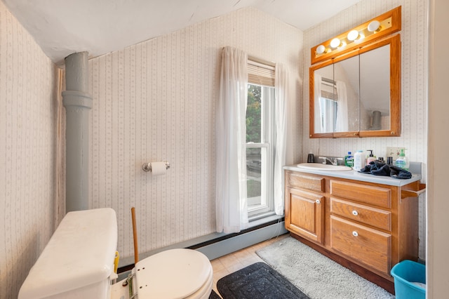 bathroom with vanity, toilet, and tile patterned floors