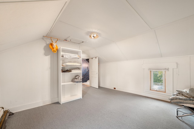 bonus room featuring lofted ceiling and carpet