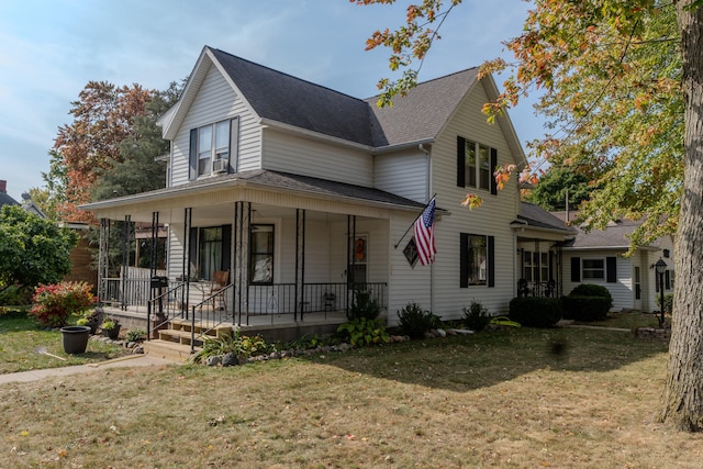 view of front of house with a front lawn and covered porch