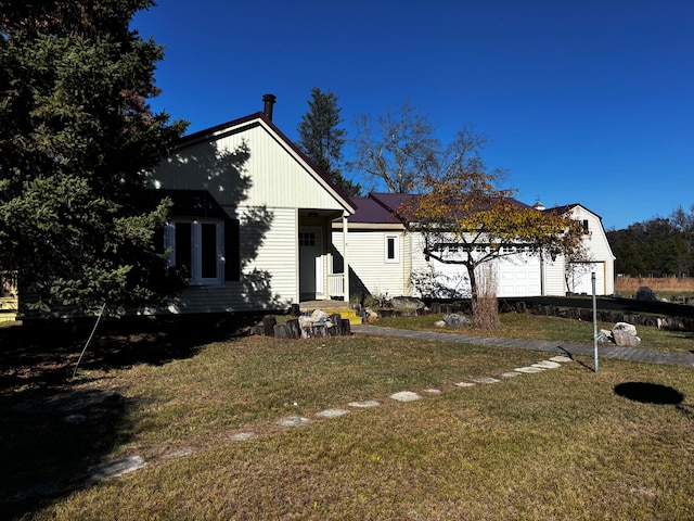 bungalow-style home featuring a front yard