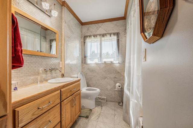 bathroom featuring vanity, tile walls, crown molding, and toilet