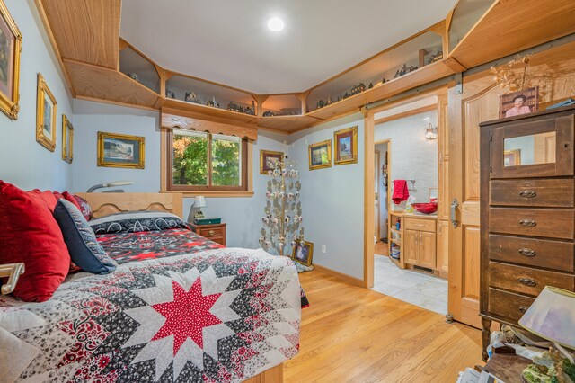 bedroom with light hardwood / wood-style flooring