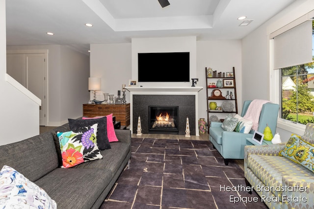 living room featuring a tray ceiling